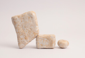 Beige white, gold stones platform podium on gray neutral natural background. Minimal empty display product presentation scene.