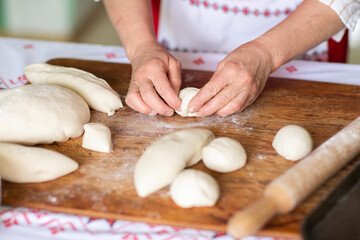 Rural Moldovan Grandma Preparing Traditional Homemade Cheese Pastry. Authentic Village Cooking. Healthy Old Customs in Moldova.
