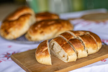 Rural Moldovan Grandma Preparing Traditional Homemade Cheese Pastry. Authentic Village Cooking. Healthy Old Customs in Moldova.
