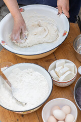Rural Moldovan Grandma Preparing Traditional Homemade Cheese Pastry. Authentic Village Cooking. Healthy Old Customs in Moldova.
