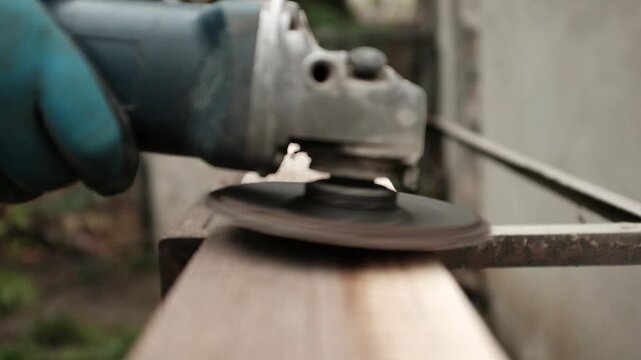 Old wood ginding. Closeup video of a worker or a craftsman working with wood. Sanding and polishing the wood. Home renovation and improvement work.