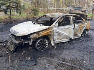 Burnt cars in parking lot, the car interior burned. Russia s war against Ukraine, drone attack on Ukrainian city Dnipo