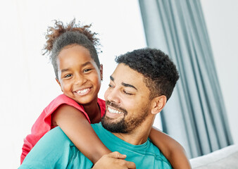 Obraz premium Portrait of father and daughter having fun at home
