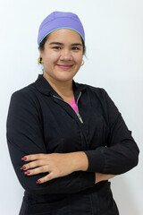 Portrait of a Latina dentist in uniform smiling and looking at the camera inside a dental office in Neiva, Huila, Colombia. Concept of Colombian people and dentistry