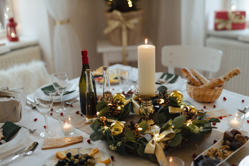 A table set for dinner meal at Christmas time.