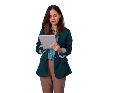 Young businesswoman standing, holding a tablet, and engaging with digital technology for remote work, isolated on a transparent background