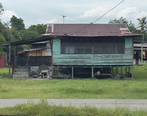 A traditional wooden house that is old and still standing is a symbol of heritage and the...