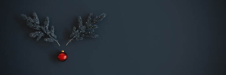 Minimalist Christmas composition featuring two pine branches arranged to resemble reindeer antlers....