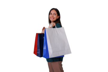 Woman standing with multiple shopping bags, smiling and looking back, expressing joy and satisfaction from consumerism