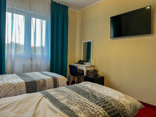 Hotel room interior with two twin beds