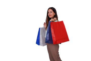 Happy woman carrying multiple colorful shopping bags, feeling satisfied after making retail purchases, transparent background