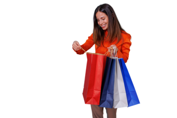 Happy woman opening shopping bag, holding purchases celebrating shopping, buyer concept on transparent background