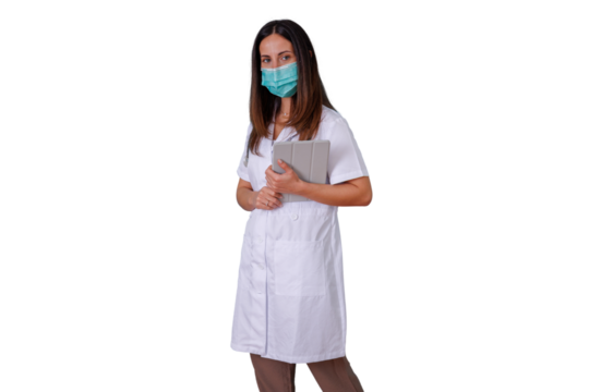 Female doctor wearing mask and white coat, holding tablet for digital health and medical consultations, transparent background - Powered by Adobe