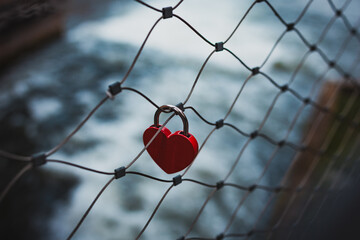 red heart on a fence