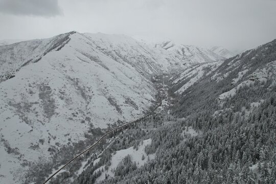 Wintery Snowscapes in Provo Canyon, Utah. Snowy tress, steep cliffs and rocky canyons. - Powered by Adobe