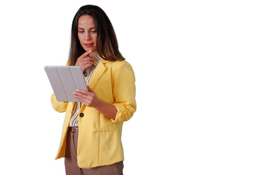 Businesswoman thinking, analyzing data on tablet, strategizing, planning, and making decisions with digital technology