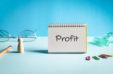 There is notebook with the word Profit. It is as an eye-catching image.