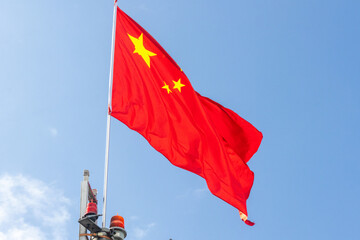 China flag with blue sky. Chinese flag