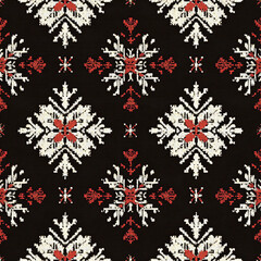 A black and white patterned rug with red and white squares