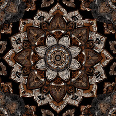 A brown and white flower with a black background