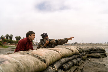 People birdwatching and photographing wildlife in wetland