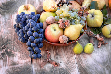 Seasonal fruit, autumn organic fruit in bowl on table, autumn still life