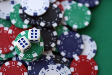 Dice game on the poker table in the casino. A successful combination of dice brought a lot of winning chips