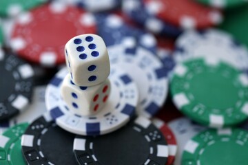 Dice game on the poker table in the casino. A successful combination of dice brought a lot of winning chips