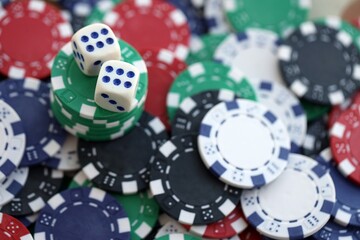 Dice game on the poker table in the casino. A successful combination of dice brought a lot of winning chips