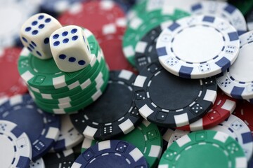 Dice game on the poker table in the casino. A successful combination of dice brought a lot of winning chips