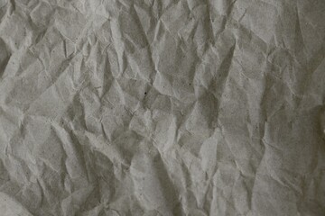 Brown crumpled recycled paper texture background. Kraft Paper