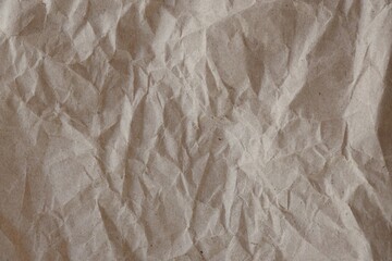 Brown crumpled recycled paper texture background. Kraft Paper