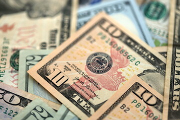 Big amount of different dollar bills close up. Hundred fifty twenty ten and five dollar banknotes