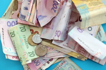 Big amount of different Ukrainian hryvnia money bills. Pile of crumpled ukrainian banknotes