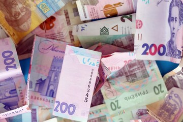 Big amount of different Ukrainian hryvnia money bills. Pile of crumpled ukrainian banknotes