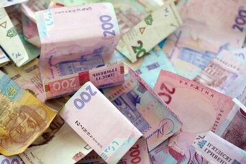 Big amount of different Ukrainian hryvnia money bills. Pile of crumpled ukrainian banknotes