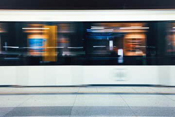 A high-speed metro train captured with strong motion blur as it passes through an urban station in Budapest, Hungary © monika.kurucz