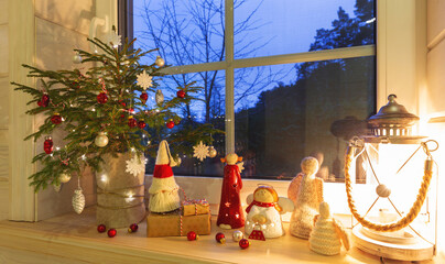 Cozy Christmas window scene with small tree, glowing lights, handmade angels, festive decor, warm evening mood, holiday inspiration, winter home atmosphere, beautiful seasonal background for