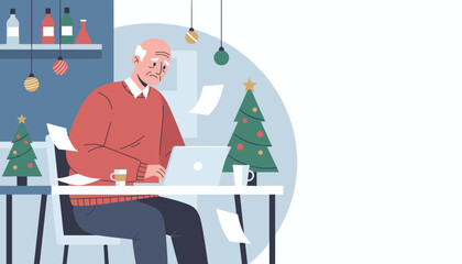 Senior man works on a laptop surrounded by paperwork and Christmas stress during the holidays