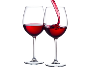 Pouring red beverage into wine glasses