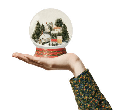 PNG Hand holding christmas snowglobe vintage decoration miniature.