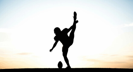 Dynamic silhouette of a flexible football player kicking high at sunset, showcasing athleticism and power, perfect for sports brands and fitness campaigns