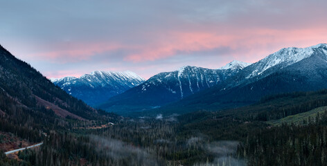 Snow-Capped Mountain Range Over Verdant Valley at Sunset in British Columbia, Canada, Panoramic Foothills