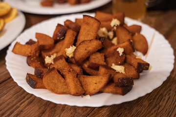 Close-up of delicious fried garlic bread, kepta duona, on wooden table, Vilnius, Lithuania