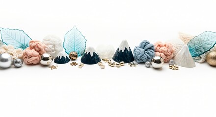 Festive holiday decorations with small mountains, leaves, and ornaments in a row
