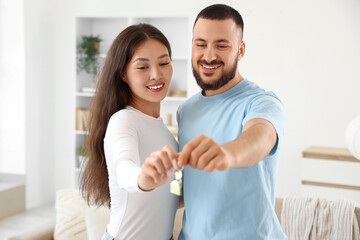 Fototapeta premium Young couple with key from their new house