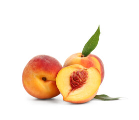 Sweet ripe peaches with leaves on white background