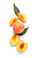 Sweet ripe peaches and leaves on white background