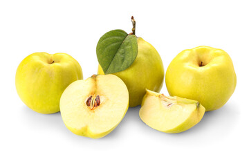 Fresh quinces with cut pieces and leaf on white background