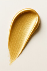 Smear of golden moisturizing cream texture isolated on white